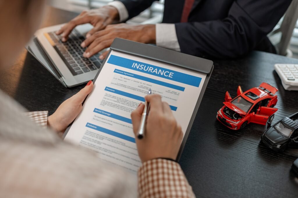 a lawyer explains the details of a car insurance policy and all the costs to a client